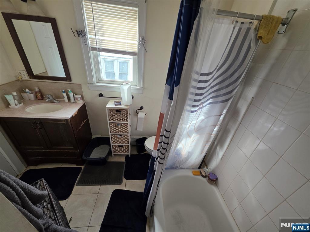 1449 Teaneck Road Teaneck, NJ 07666 - Photo 20 of 26 a view of a livingroom with furniture and windows