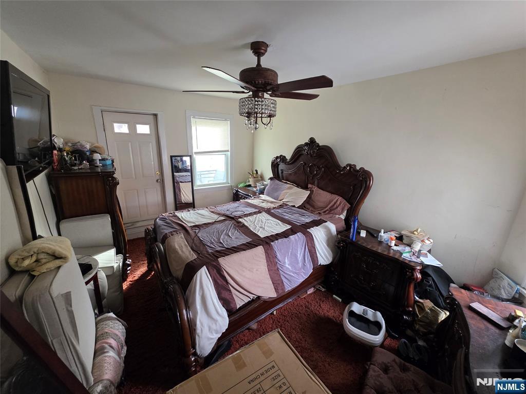 1449 Teaneck Road Teaneck, NJ 07666 - Photo 22 of 26 a bedroom with a bed and wooden floor