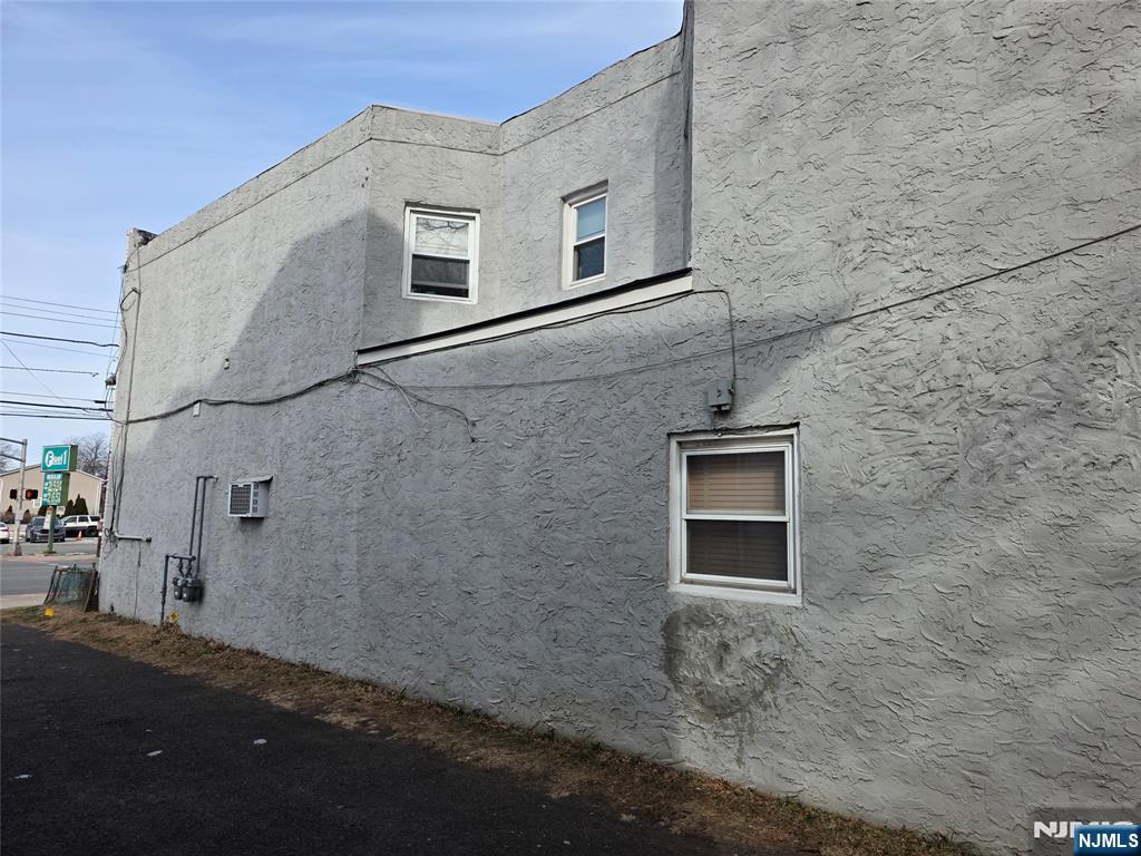 1449 Teaneck Road Teaneck, NJ 07666 - Photo 4 of 26 a view of a brick house with many windows