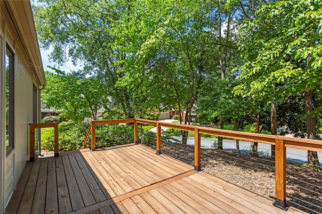 117 Riverpoint Drive Clemson, SC 29631 - Photo 37 of 47 This outdoor deck provides a serene retreat amidst lush greenery.