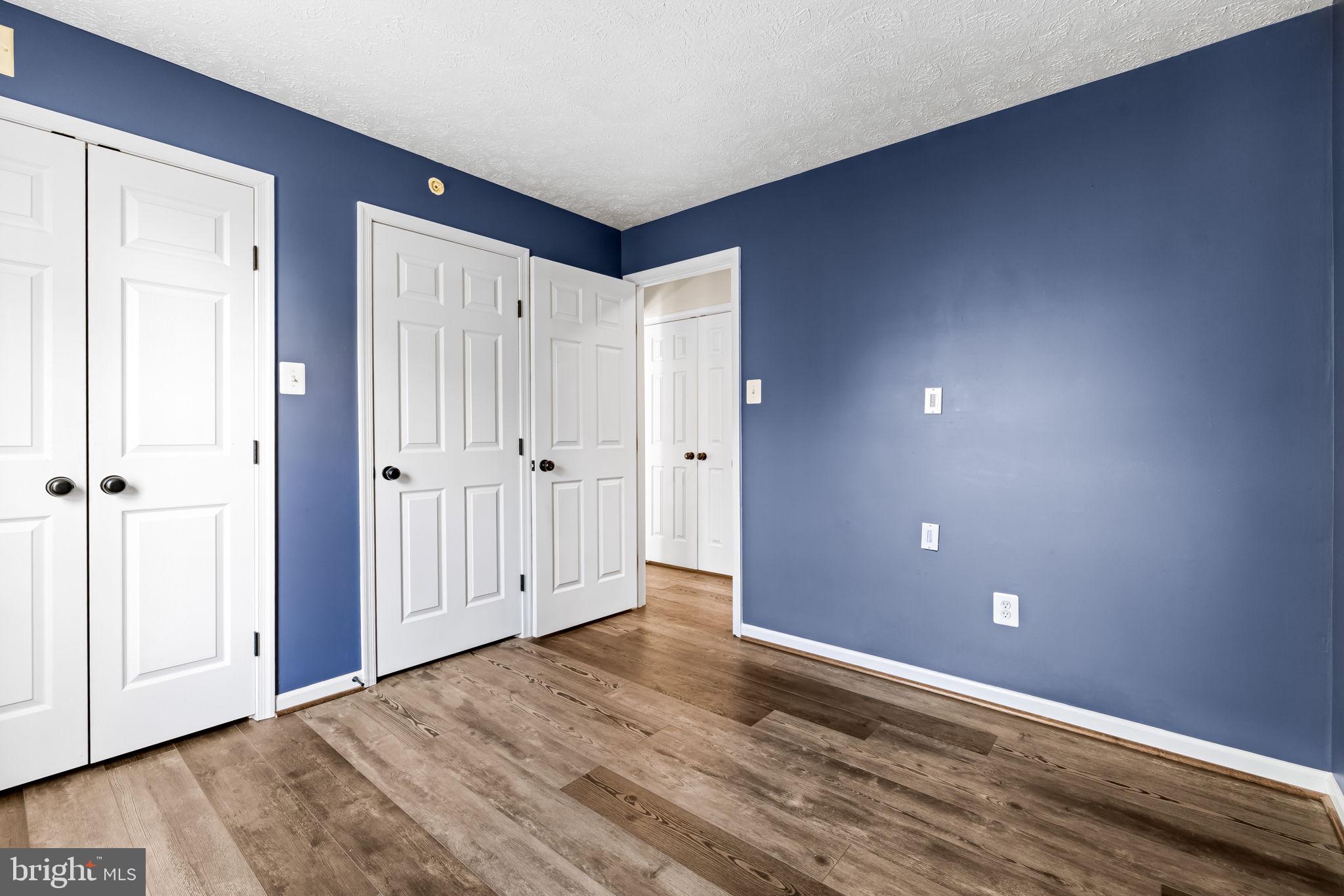 41 Laurel Path Court, Unit 5 Baltimore, MD 21236 - Photo 22 of 32 a view of an empty room with wooden floor