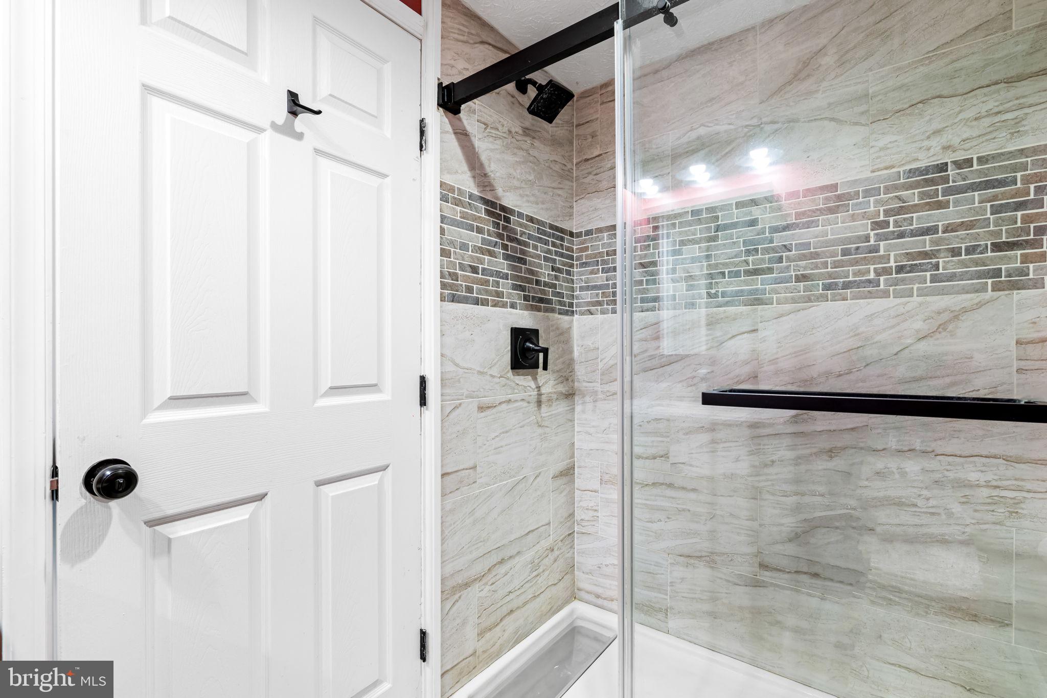 41 Laurel Path Court, Unit 5 Baltimore, MD 21236 - Photo 24 of 32 a bathroom with a shower