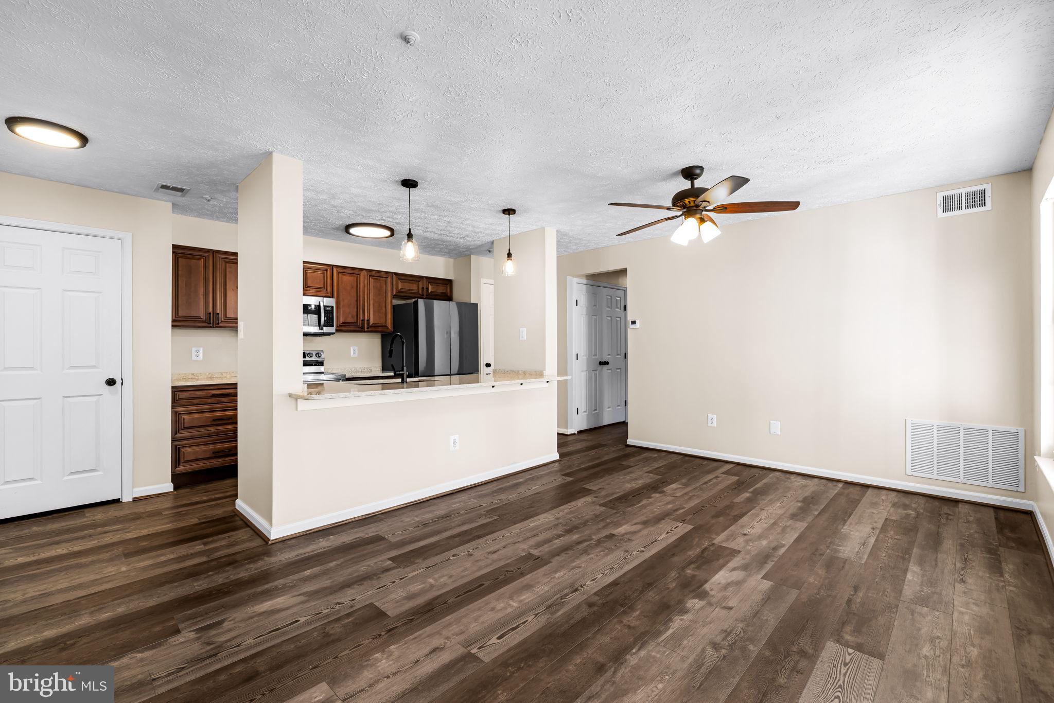 41 Laurel Path Court, Unit 5 Baltimore, MD 21236 - Photo 4 of 32 a view of a kitchen with wooden floor