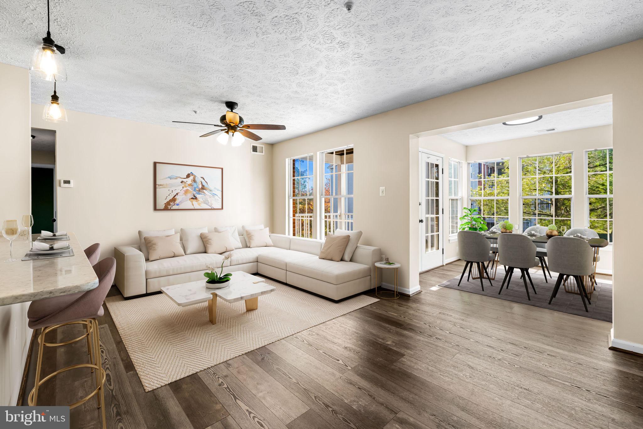41 Laurel Path Court, Unit 5 Baltimore, MD 21236 - Photo 7 of 32 a living room with furniture and a large window