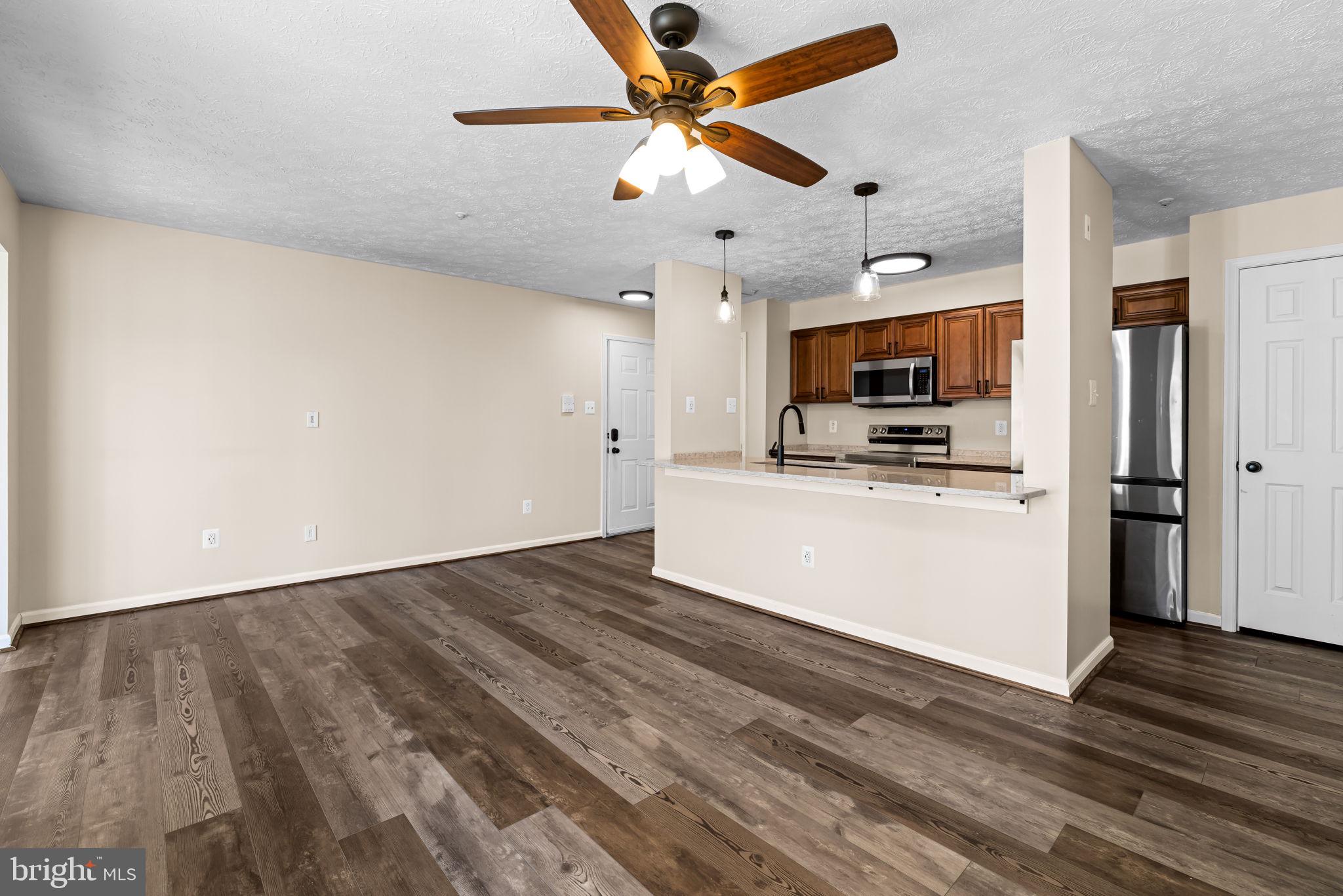 41 Laurel Path Court, Unit 5 Baltimore, MD 21236 - Photo 9 of 32 a view of cabinets and wooden floor