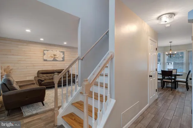 a view of a room with wooden floor and stairs