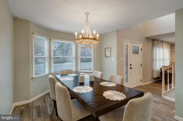 a view of a dining room with furniture and window