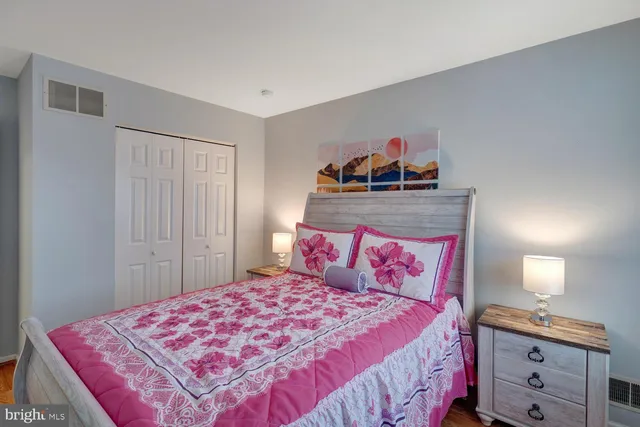 a bedroom with a bed and a dresser