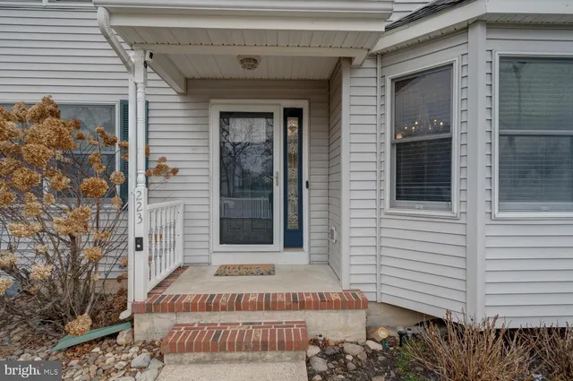 a view of an entryway with wooden floor