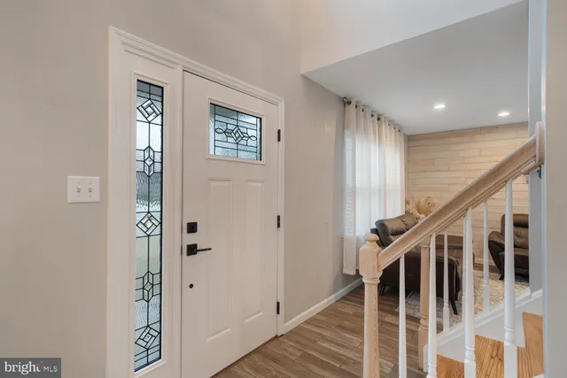 a view of a livingroom with furniture and wooden floor