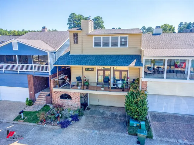 a view of a livingroom with wooden floor and furniture
