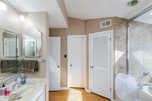 a bathroom with a bathtub and a shower