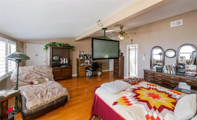 a view of a room with furniture and a potted plant