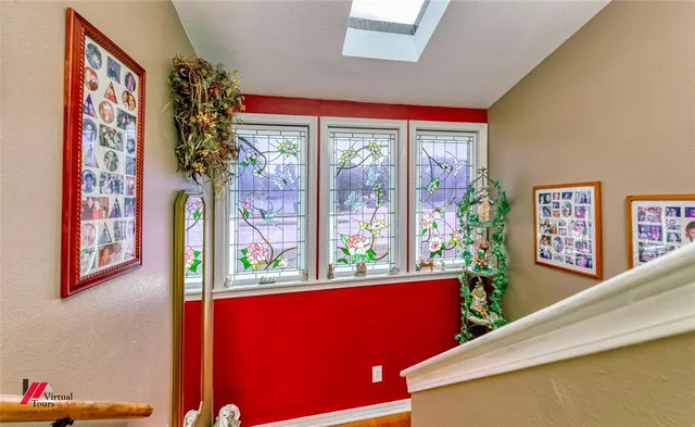a living room with furniture a rug and a window