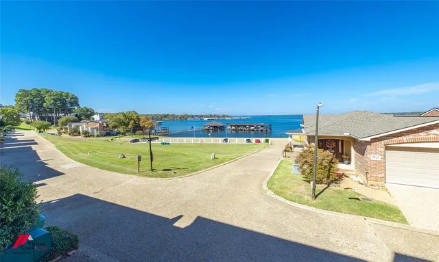 a view of a balcony next to a yard