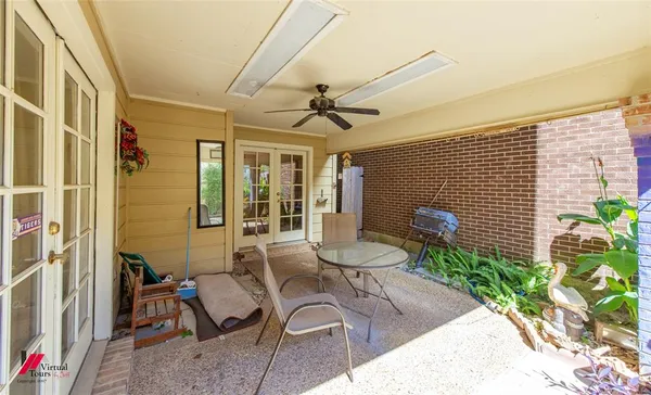 a view of a dining room with furniture and a livingroom