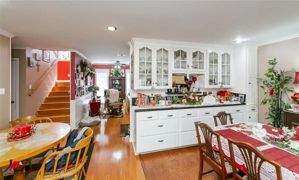 a living room with lots of furniture and chandelier