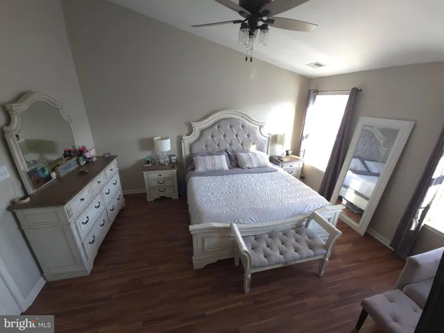 a bed room with furniture and a chandelier