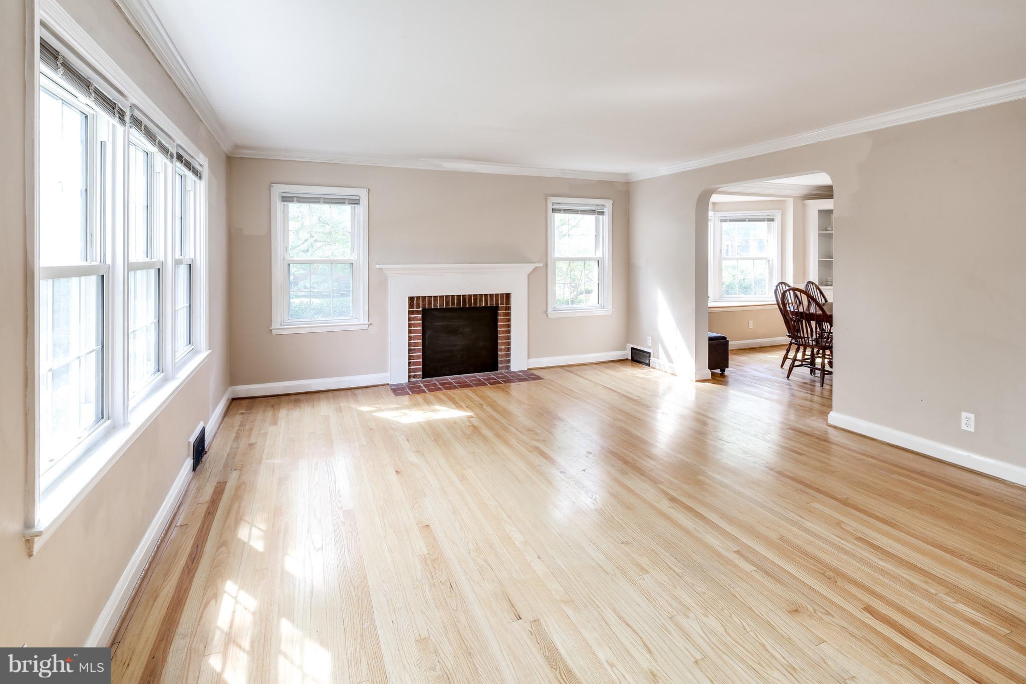 1611 Feldbrook Road Towson, MD 21286 - Photo 6 of 27 Living Room w/ Hardwood & Wood-burning FP
