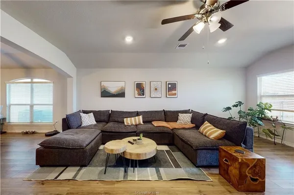 a living room with furniture and a large window