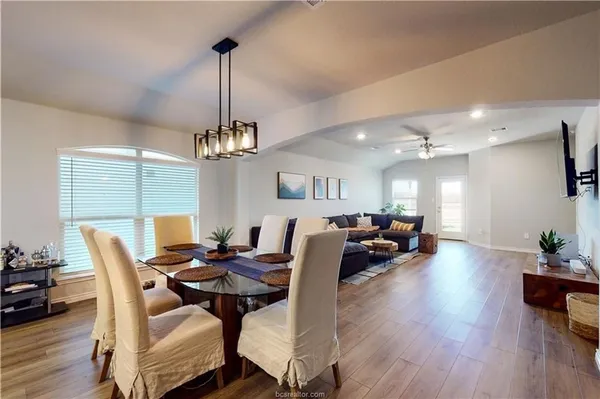 a view of a dining room with furniture window and wooden floor