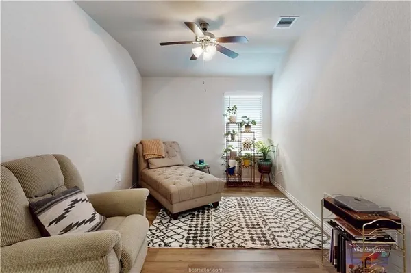 a bedroom with furniture and a chandelier
