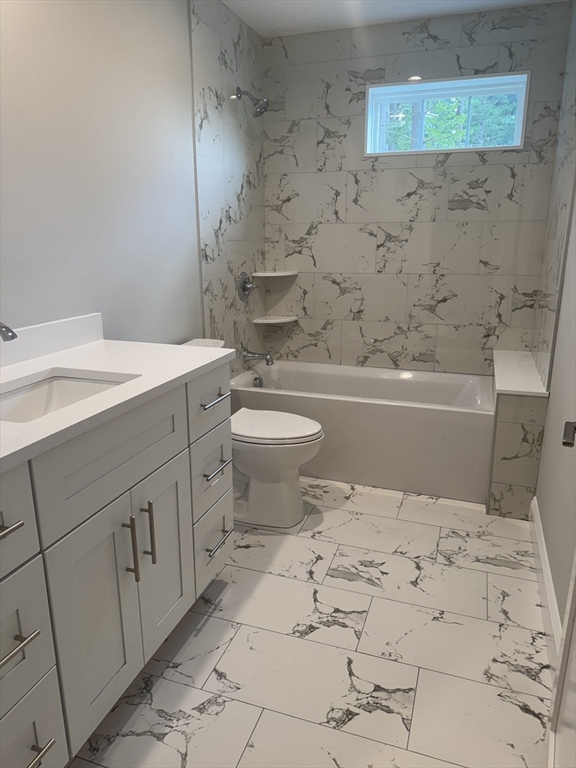 27 James Road, Unit 2 Upton, MA 01568 - Photo 15 of 31 a bathroom with a sink a toilet and bathtub