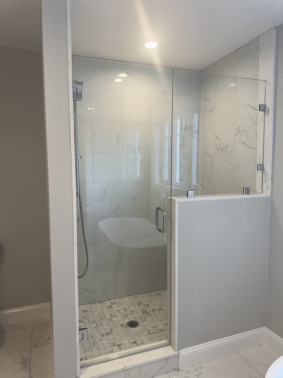 27 James Road, Unit 2 Upton, MA 01568 - Photo 9 of 31 a bathroom with a shower and toilet