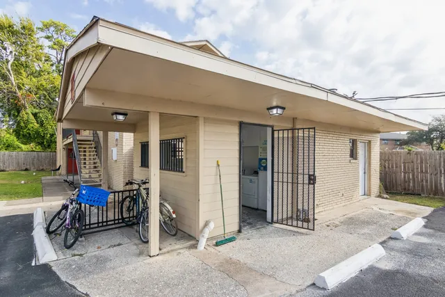 a front view of a house with outdoor seating