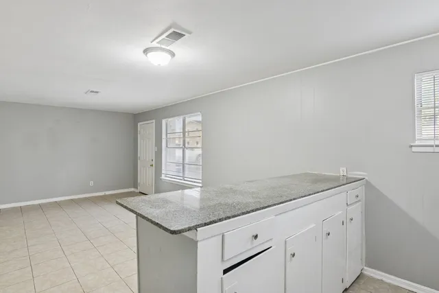 a view of a kitchen with a sink and dishwasher
