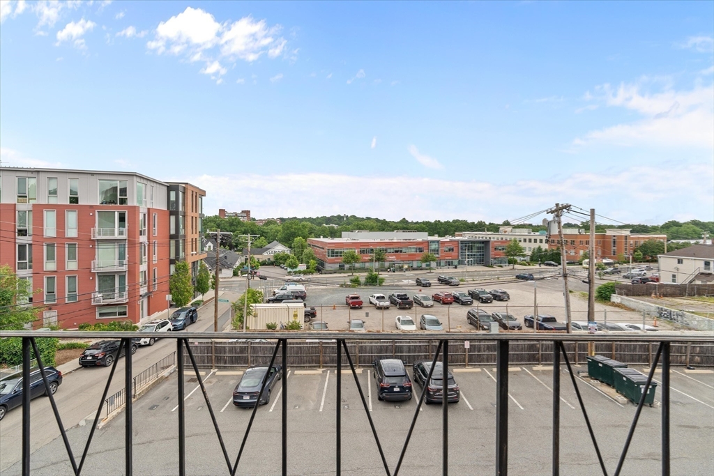 26 Waverly Street, Unit 410 Boston, MA 02135 - Photo 20 of 32 a view of a balcony with chairs