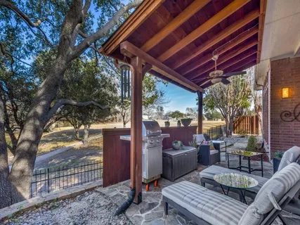 a view of a patio with couches chairs and a potted plant
