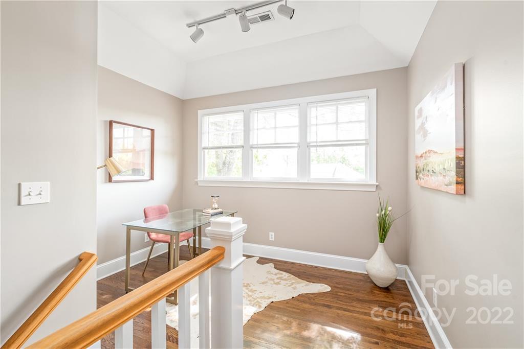2208 Club Road Charlotte, NC 28205 - Photo 16 of 25 a view of a bedroom with wooden floor and furniture
