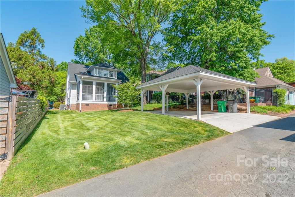 2208 Club Road Charlotte, NC 28205 - Photo 24 of 25 a house with green field in front of it