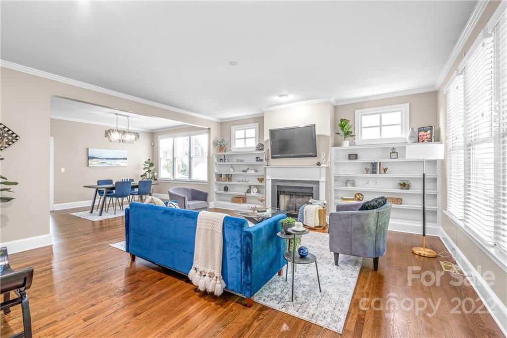 2208 Club Road Charlotte, NC 28205 - Photo 5 of 25 a living room with fireplace furniture and a wooden floor