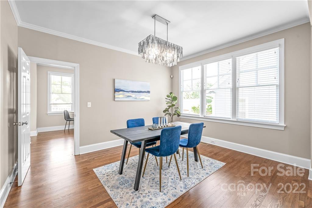2208 Club Road Charlotte, NC 28205 - Photo 6 of 25 a view of a dining room with furniture window and wooden floor