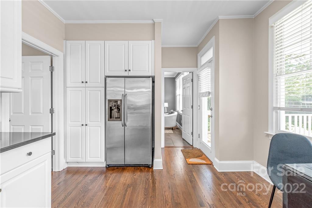 2208 Club Road Charlotte, NC 28205 - Photo 10 of 25 a kitchen with stainless steel appliances granite countertop a refrigerator and a stove