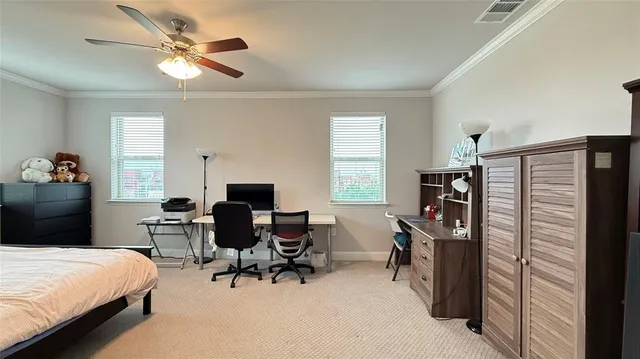 a bedroom with furniture and a window