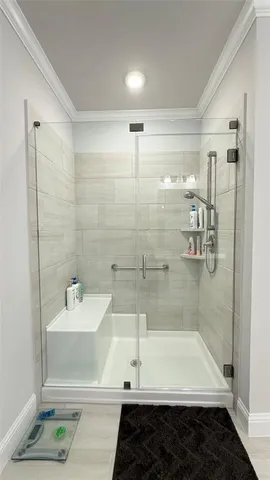 a bathroom with a bathtub and a shower