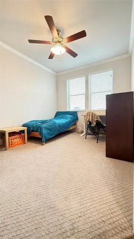 a living room with furniture and a air conditioner vent