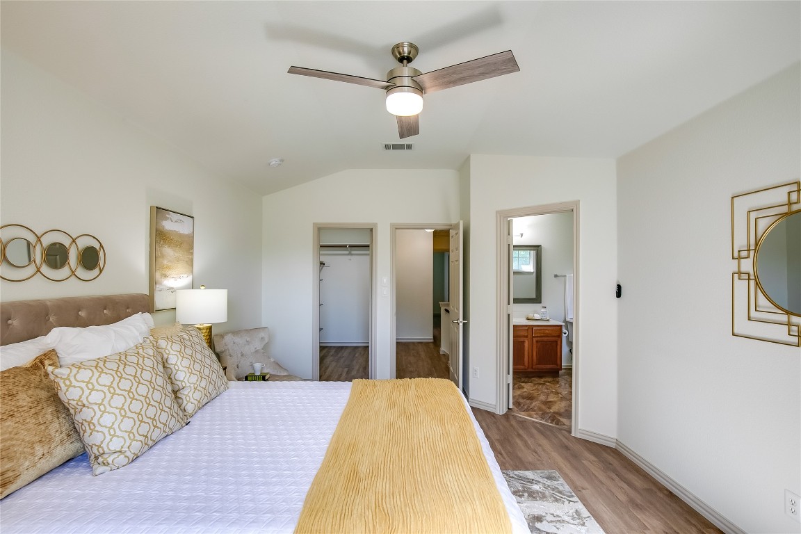 2410 Great Oaks Drive, Unit 804 Round Rock, TX 78681 - Photo 20 of 37 a bed room with a bed and a chandelier