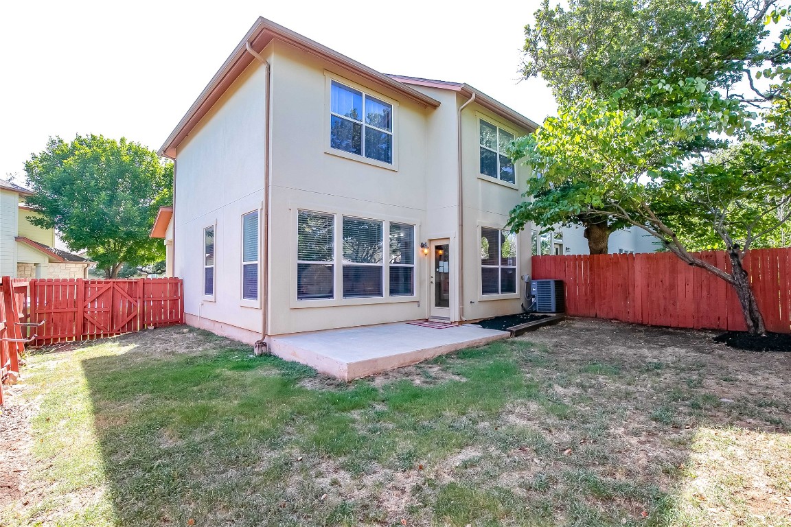 2410 Great Oaks Drive, Unit 804 Round Rock, TX 78681 - Photo 29 of 37 a view of a house with a yard and wooden fence