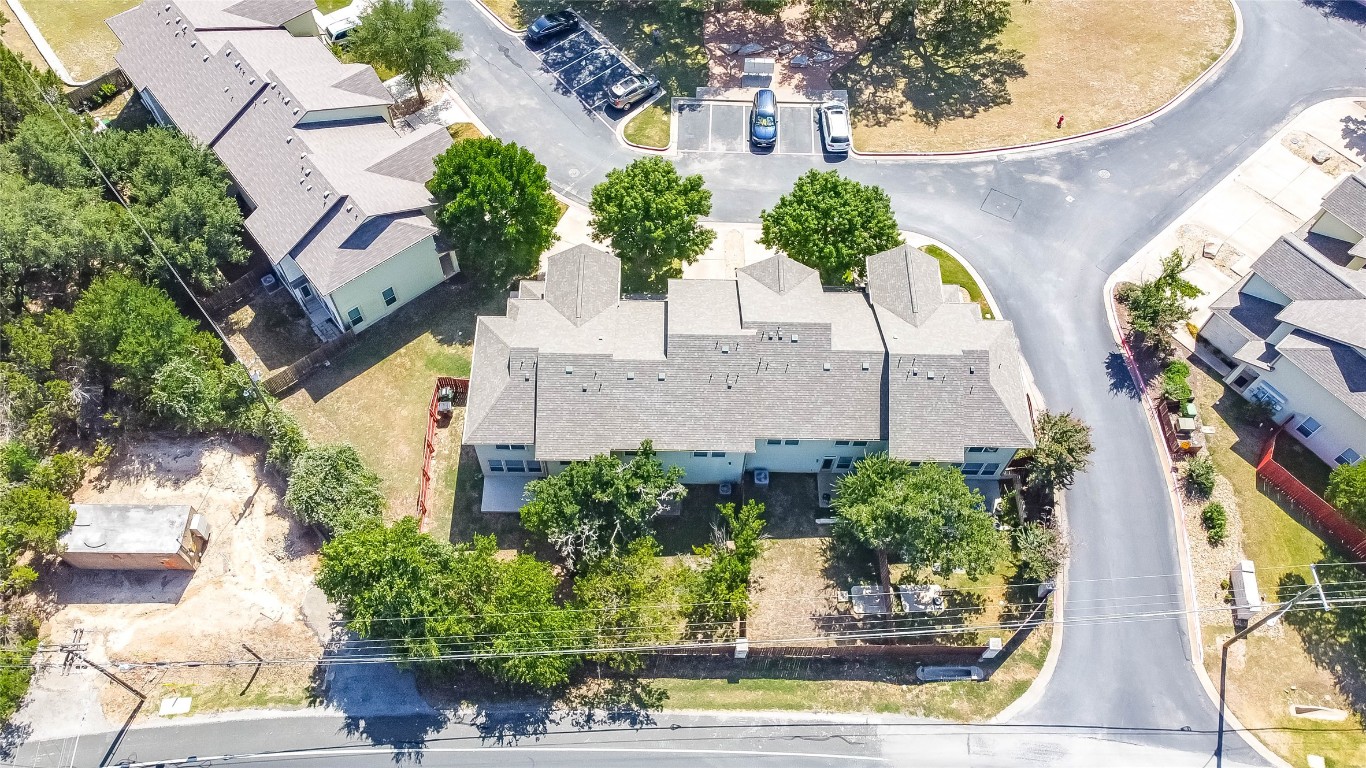 2410 Great Oaks Drive, Unit 804 Round Rock, TX 78681 - Photo 34 of 37 an aerial view of a house with a yard and fountain