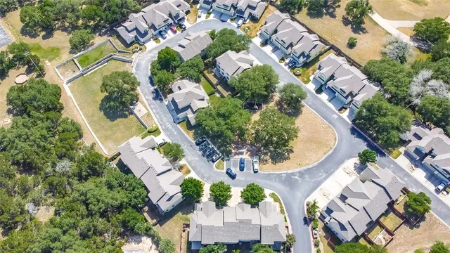 an aerial view of a house with a swimming pool