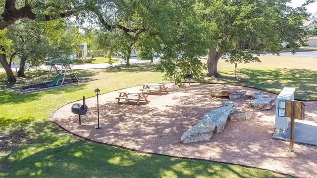 a view of a yard with swimming pool