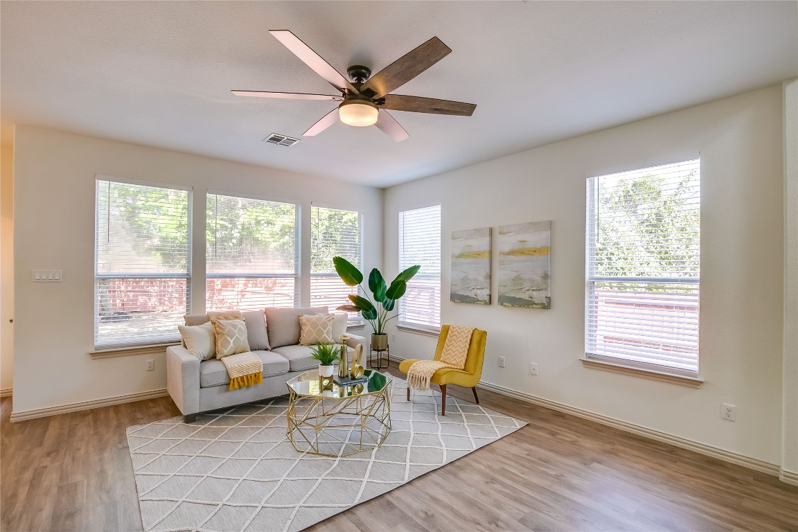 2410 Great Oaks Drive, Unit 804 Round Rock, TX 78681 - Photo 9 of 37 a living room with furniture and a large window