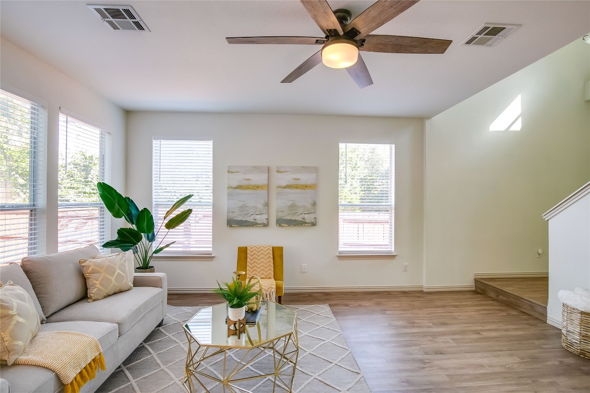 2410 Great Oaks Drive, Unit 804 Round Rock, TX 78681 - Photo 10 of 37 a living room with furniture chandelier and window