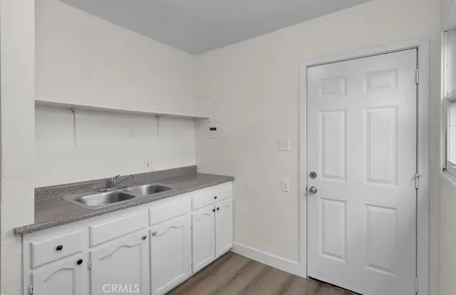a utility room with cabinets