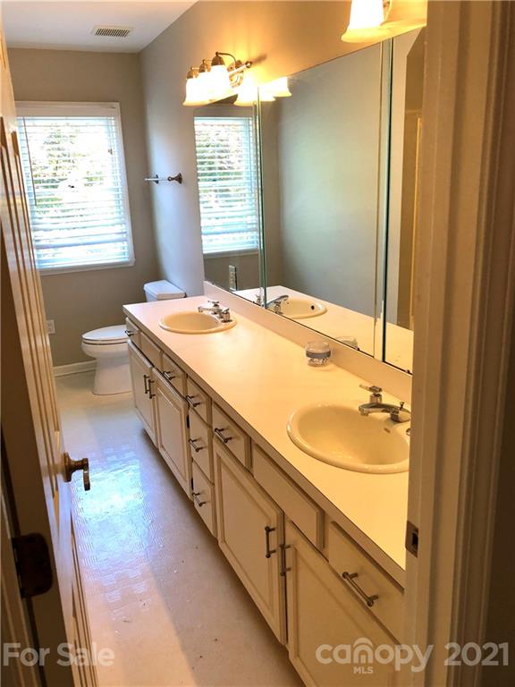 4516 Kiser Island Road Terrell, NC 28682 - Photo 13 of 19 a spacious bathroom with a granite countertop sink and a mirror