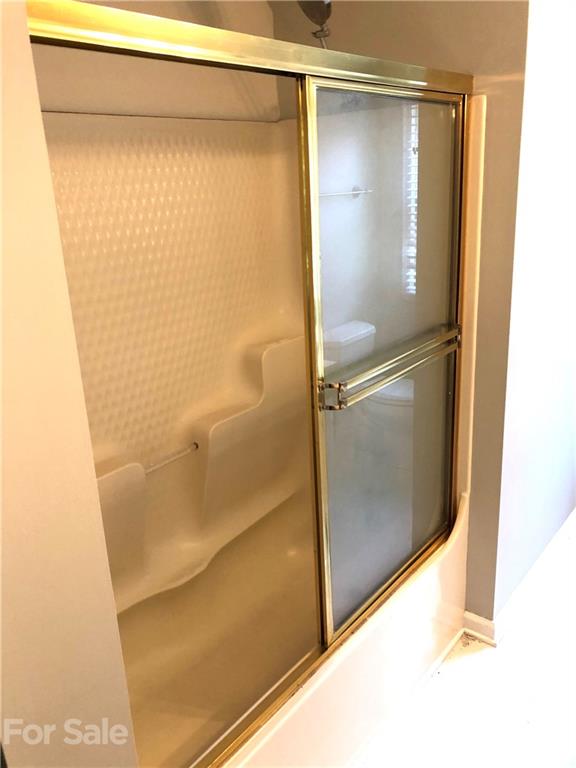 4516 Kiser Island Road Terrell, NC 28682 - Photo 14 of 19 a bathroom with a glass shower door